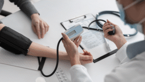 Doctor performing medical examination for Australian visa applicants.